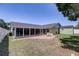 Expansive backyard with a patio, fire pit, and a shed for extra storage at 1416 Buckner Rd, Valrico, FL 33596