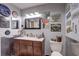 This uniquely decorated bathroom features vintage signs and a wood vanity at 1416 Buckner Rd, Valrico, FL 33596
