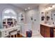 Bright bathroom featuring a glass enclosed shower and built-in vanity with a dressing table at 1416 Buckner Rd, Valrico, FL 33596