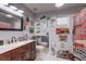 Unique bathroom featuring vintage signs, a wooden vanity, and neutral tile at 1416 Buckner Rd, Valrico, FL 33596