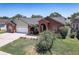 Attractive single-story house with brick and light green exterior, well-kept lawn, and attached two-car garage at 1416 Buckner Rd, Valrico, FL 33596