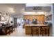 Spacious kitchen with breakfast bar, tile backsplash and stainless appliances, adjacent to sunny sitting area at 1416 Buckner Rd, Valrico, FL 33596