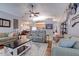 Bright and airy living room with comfortable furnishings and open view of the kitchen at 1416 Buckner Rd, Valrico, FL 33596