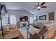 Inviting living room featuring a fireplace, hardwood floors, ceiling fan and comfortable furnishings at 1416 Buckner Rd, Valrico, FL 33596