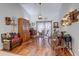 Spacious living room showcasing hardwood floors, high ceilings, and distinctive decor with unique lighting fixtures at 1416 Buckner Rd, Valrico, FL 33596