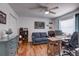 Bright home office with hard wood floors, a comfy couch, and neutral paint at 1416 Buckner Rd, Valrico, FL 33596