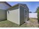 Outdoor shed with a convenient ramp, providing additional storage space at 1416 Buckner Rd, Valrico, FL 33596