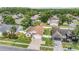 Aerial view of a well-kept single-story home with a lush green lawn in a quiet neighborhood at 14920 Rocky Ledge Dr, Tampa, FL 33625
