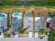 Overhead image of homes with pools in a community, adjacent to a waterfront area and neighborhood streets at 1601 Westerly Dr, Brandon, FL 33511