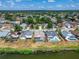 Expansive aerial view captures community homes lining a waterfront, blending residential life with nature's beauty at 1601 Westerly Dr, Brandon, FL 33511
