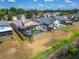 Overhead view showcasing the backyard with pool, screened enclosure, wooden fence and proximity to the water's edge at 1601 Westerly Dr, Brandon, FL 33511