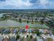 Aerial shot of a lakeside suburban neighborhood with a location pin highlighting a home near the water at 1601 Westerly Dr, Brandon, FL 33511