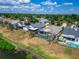 A high angle view of a backyard pool with screened enclosure in a neighborhood setting at 1601 Westerly Dr, Brandon, FL 33511