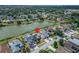 Overhead view of a house in a lakeside community, marked by a location pin, surrounded by mature trees at 1601 Westerly Dr, Brandon, FL 33511
