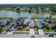Beautiful aerial shot of a lakeside neighborhood showcasing homes with lush green surroundings at 1601 Westerly Dr, Brandon, FL 33511