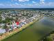 Aerial view of a neighborhood by a lake, a location pin indicates a property with water access and mature trees at 1601 Westerly Dr, Brandon, FL 33511