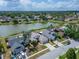 Picturesque aerial view of a community with houses nestled along a peaceful lake and green landscape at 1601 Westerly Dr, Brandon, FL 33511