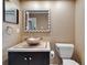 Bathroom featuring a vessel sink, a framed mirror, and neutral colored walls at 1601 Westerly Dr, Brandon, FL 33511