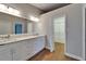 Bathroom vanity offers marble countertops, double sinks, and a walk in closet at 1601 Westerly Dr, Brandon, FL 33511