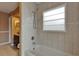 Bathroom with shower and tub and a vanity sink with decorative mirror at 1601 Westerly Dr, Brandon, FL 33511