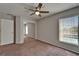 Bedroom with mirrored closet doors and a window overlooking the pool area at 1601 Westerly Dr, Brandon, FL 33511