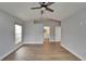Bright bedroom features wood look tile floors and a window that lets in natural light at 1601 Westerly Dr, Brandon, FL 33511