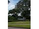 Providence Lakes community sign nestled among mature landscaping and vibrant green foliage at 1601 Westerly Dr, Brandon, FL 33511