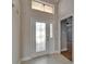 Bright foyer with decorative glass door, tile flooring, and an open view into the main living areas at 1601 Westerly Dr, Brandon, FL 33511