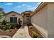 Stunning home entryway with a brick walkway, manicured landscaping, and a decorative front door at 1601 Westerly Dr, Brandon, FL 33511