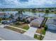 Inviting single-Gathering home with a manicured lawn and an attached two-car garage, set against a serene lake backdrop at 1601 Westerly Dr, Brandon, FL 33511