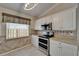 A well-lit kitchen with white cabinetry, granite countertops, and stainless steel double oven at 1601 Westerly Dr, Brandon, FL 33511