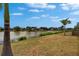 Picturesque view of a tranquil lake from the property, creating a serene and inviting atmosphere for homeowners at 1601 Westerly Dr, Brandon, FL 33511