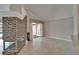 Bright living room with tile floors, fireplace, and sliding glass doors to lanai at 1601 Westerly Dr, Brandon, FL 33511