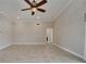 Large living room with tile floors, ceiling fan, and plenty of space at 1601 Westerly Dr, Brandon, FL 33511