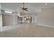 Open concept living room featuring tile floors, fireplace, and vaulted ceilings at 1601 Westerly Dr, Brandon, FL 33511