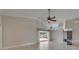 Spacious living room with tile floors, fireplace, ceiling fan, and pool view at 1601 Westerly Dr, Brandon, FL 33511