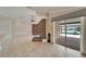 Living room with fireplace and sliding glass doors leading to the screened pool area at 1601 Westerly Dr, Brandon, FL 33511