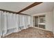 Covered patio showcasing brick flooring, with a sliding door and privacy curtains for outdoor relaxation at 1601 Westerly Dr, Brandon, FL 33511
