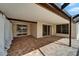 Spacious covered patio featuring brick flooring, sliding doors, and ample space for outdoor seating at 1601 Westerly Dr, Brandon, FL 33511