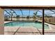 Beautiful screened pool offering lake views, complete with a rock waterfall and a spacious deck area at 1601 Westerly Dr, Brandon, FL 33511