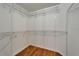 Walk-in closet with wood-look tile floors features wire shelving at 1601 Westerly Dr, Brandon, FL 33511