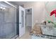 Bathroom with a glass shower with a tile surround with access to the en suite at 16605 Round Oak Dr, Tampa, FL 33618