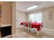 Dining room offers neutral walls, tiled floor, and view of the front entrance at 16605 Round Oak Dr, Tampa, FL 33618