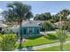 Charming home featuring lush landscaping and a well-manicured lawn, enhancing curb appeal at 16605 Round Oak Dr, Tampa, FL 33618