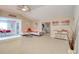Bright open-concept living space with tile flooring, vaulted ceilings, and a dining area with natural light at 16605 Round Oak Dr, Tampa, FL 33618