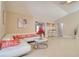 Bright, airy living room with tile floors, vaulted ceiling and comfortable seating, perfect for relaxation at 16605 Round Oak Dr, Tampa, FL 33618