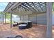 Covered outdoor seating area featuring comfortable wicker furniture, perfect for relaxing and entertaining guests at 16605 Round Oak Dr, Tampa, FL 33618