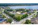 Aerial view of community amenities with basketball court, sand volleyball, playground and lake at 16802 Fairbolt Way, Odessa, FL 33556