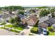 Aerial view of a home showcasing its manicured lawn, landscaping, driveway and desirable neighborhood setting at 16802 Fairbolt Way, Odessa, FL 33556