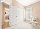 A bedroom featuring a double door closet and a plantation shuttered window at 16802 Fairbolt Way, Odessa, FL 33556